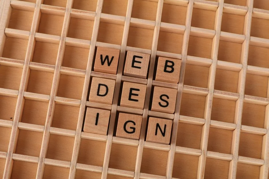 Scrabble tiles arranged on a wooden surface to spell the word Website, representing digital communication.
